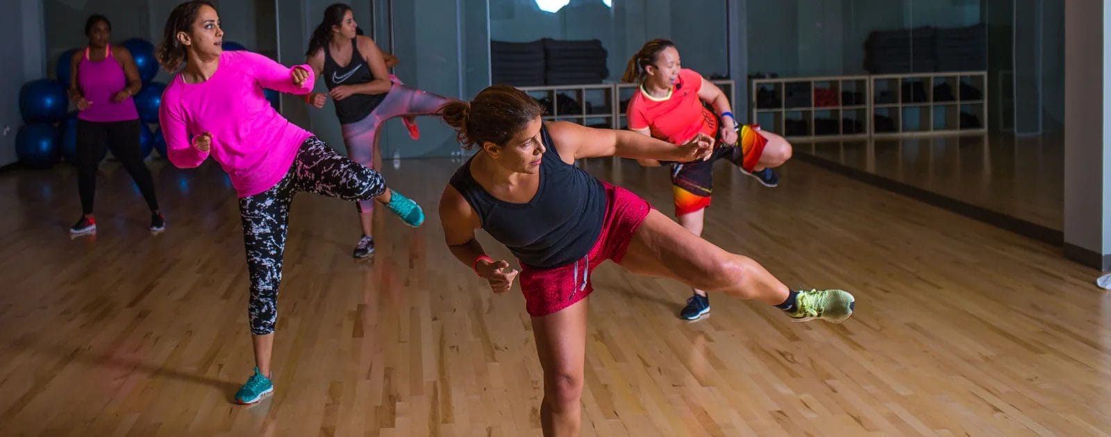 a stretching group exercise with legs wide open