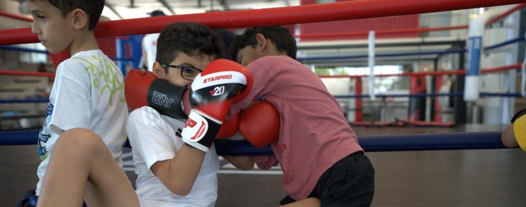 kids are performing kick boxing in fitrepublik