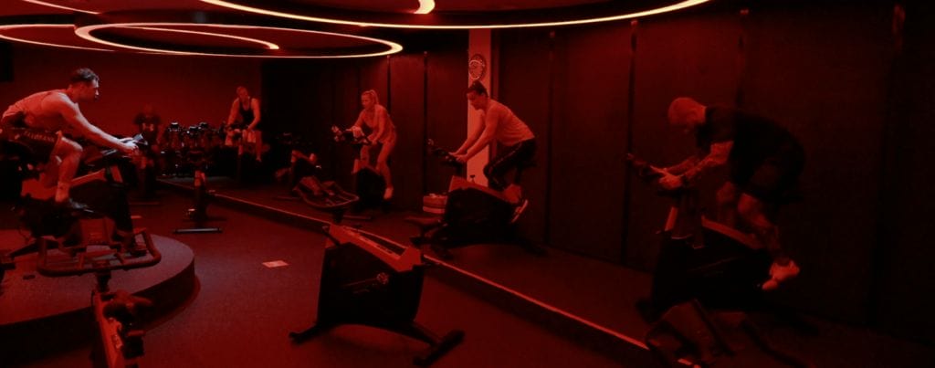 a set of people are cycling together